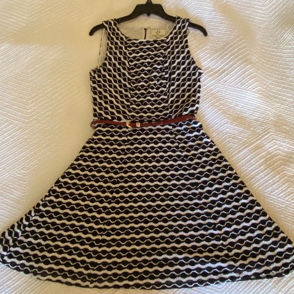 Knitted black and white overlayed onto a white dress w/ a burgundy red thin belt